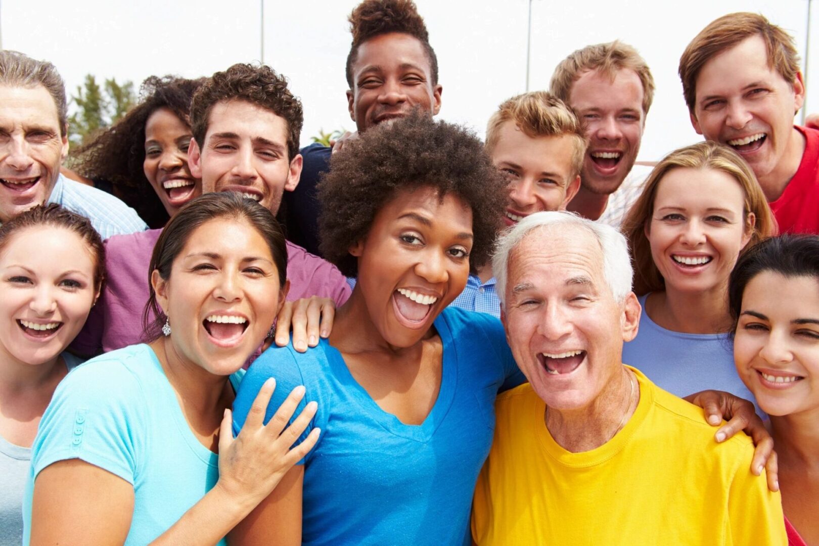 A group of people that are smiling for the camera